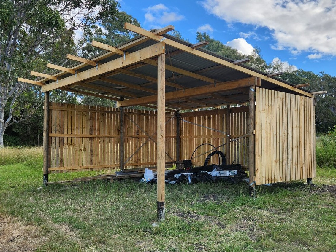 The completed pole barn shed, framed and roofed