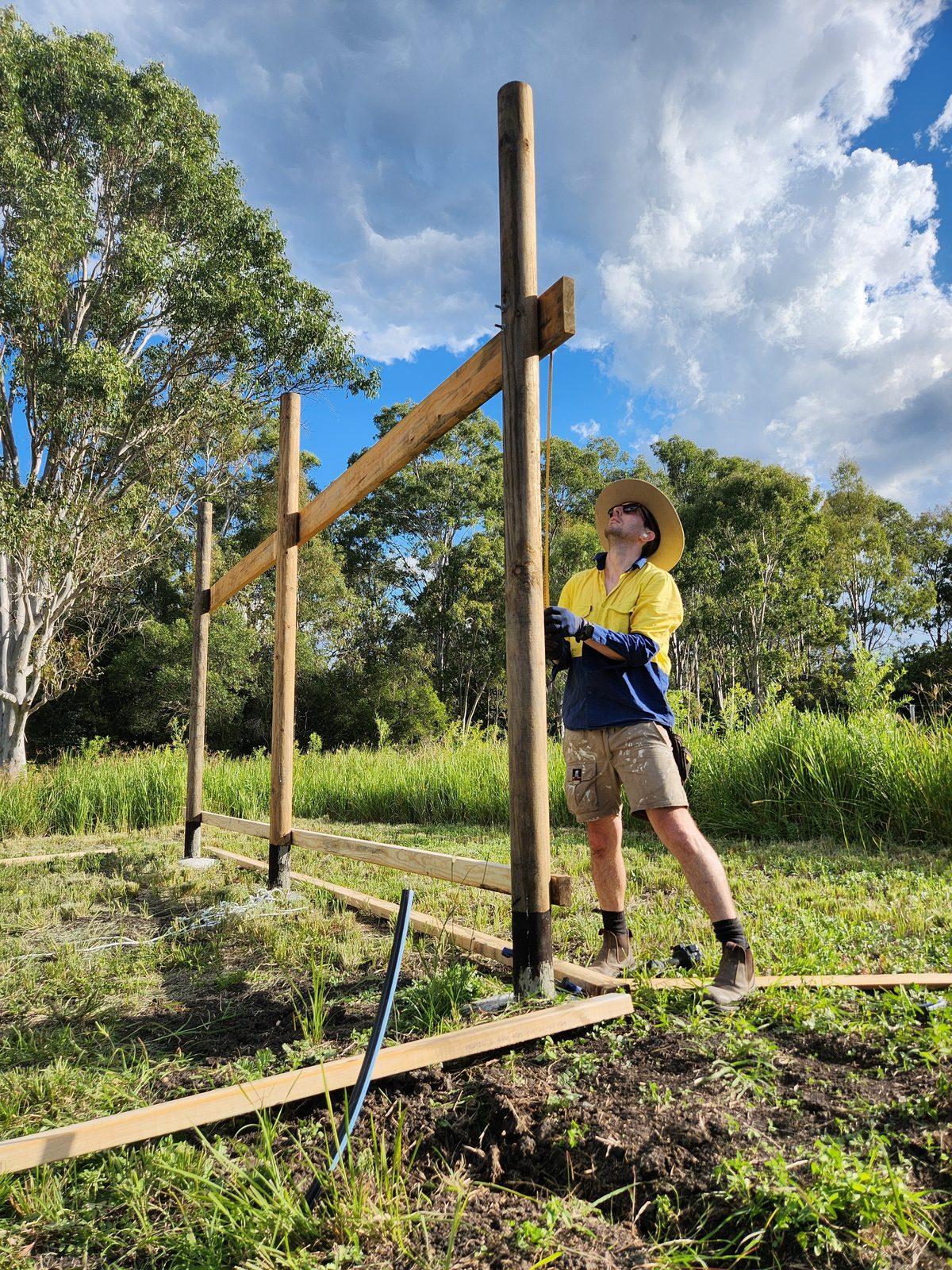 Clayton on site setting out posts for the pole barn shed
