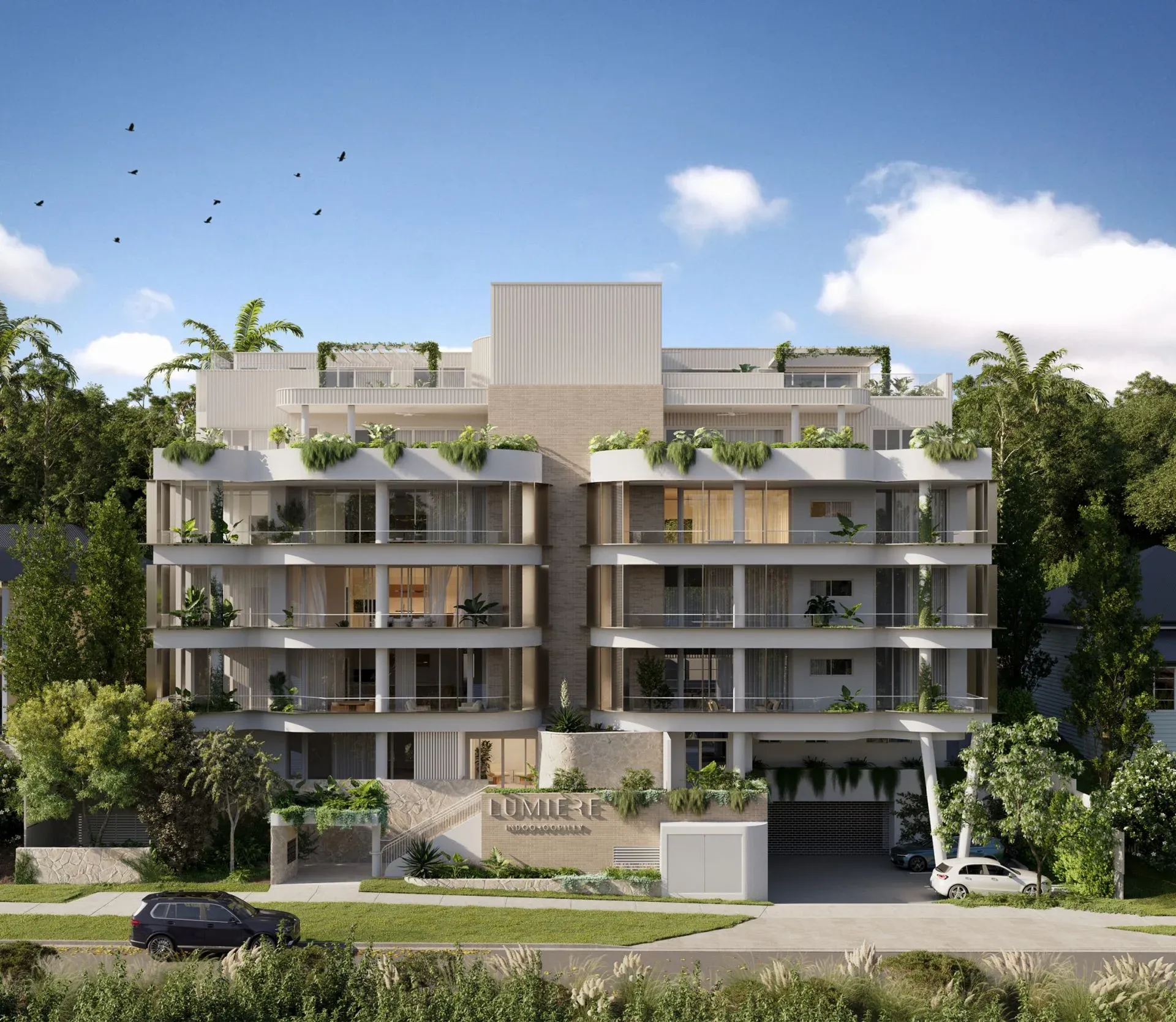 Render of the Lumiere Residences apartment building, five levels of curved planted balconies above a landscaped street