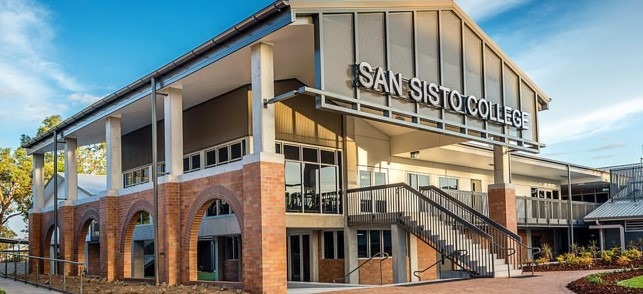 The Dominic Centre at San Sisto College, a two-storey building with a brick arched colonnade and external stair